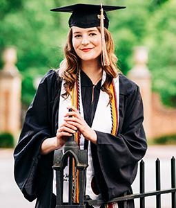 Emily Wood poses in her cap and gown