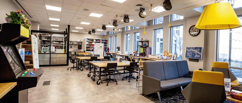 a picture of the new rhodos makerspace in campus village with tables and equipment in the space