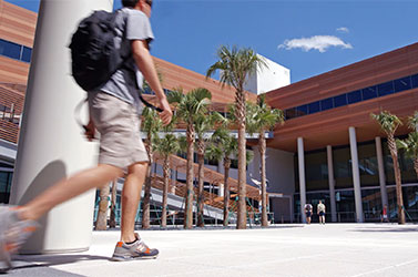 Student walking in the Darla Moore School of Business