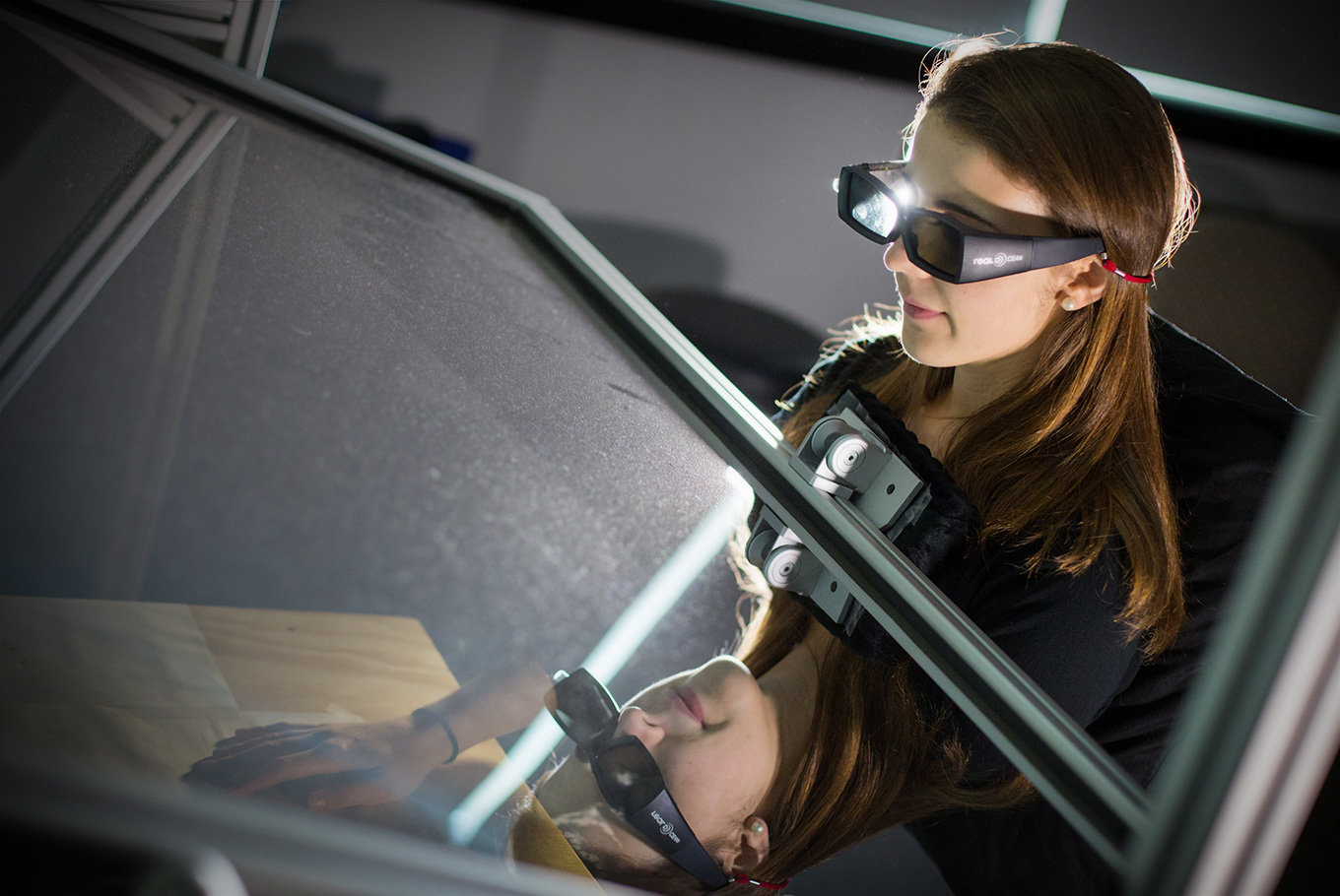 Girl student researching with special 3-D glasses