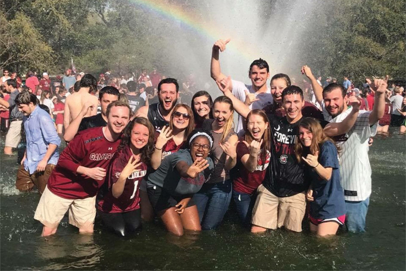 Students celebrating in the Thomas Cooper Library fountain