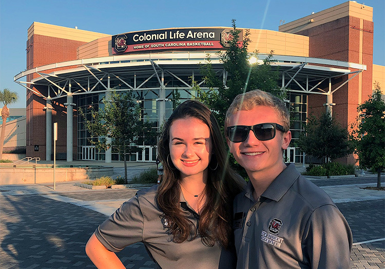 Shannon McDonald and fellow orientation leader in front of Colonial Life Arena