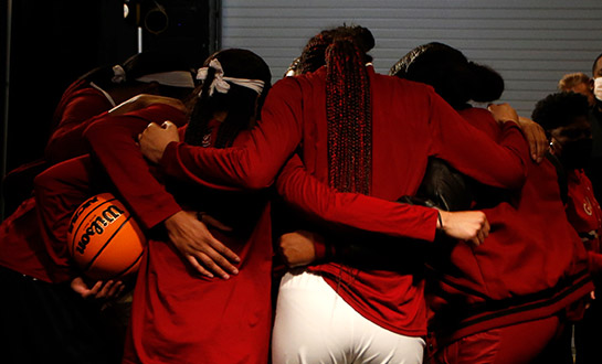 The players from the Gamecock Women's Basketball team huddled together before the semifinals game of the NCAA championship tournament.