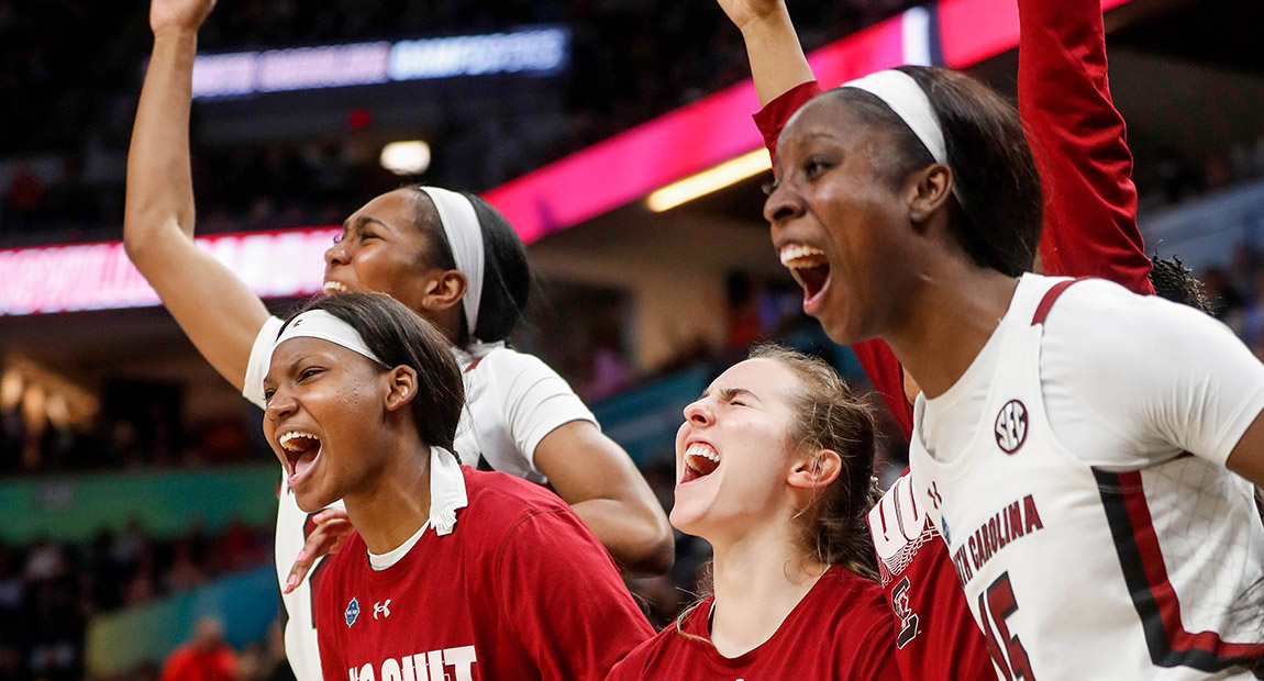 The players from the Gamecock Women's Basketball team celebrate their win.
