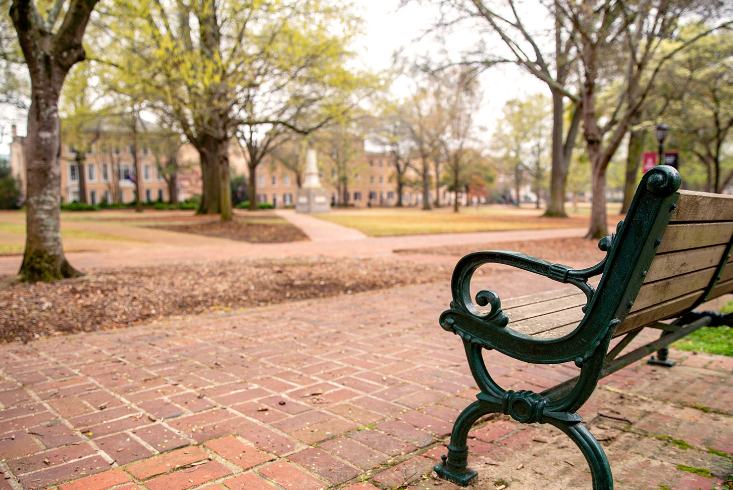 an empty park bench overlooking the historic Horseshoe