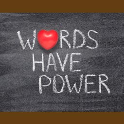a blackboard with 'words have power' written on it.