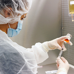 Student in sterile compounding lab
