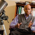 Professor teaches with a telescope 