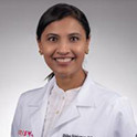 Headshot of Shilpa Srinivasan in a white lab coat. 