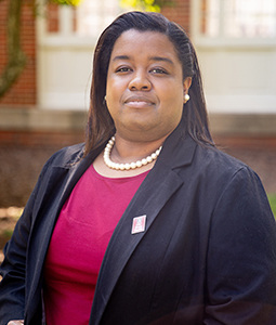 Headshot of Shermaine Augustus outdoors.