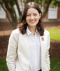 Headshot of Alyssa Blickensderfer outdoors in a suit. 