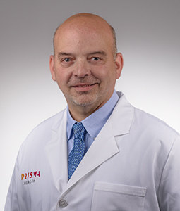 Headshot of Mark Friedman in a white lab coat.