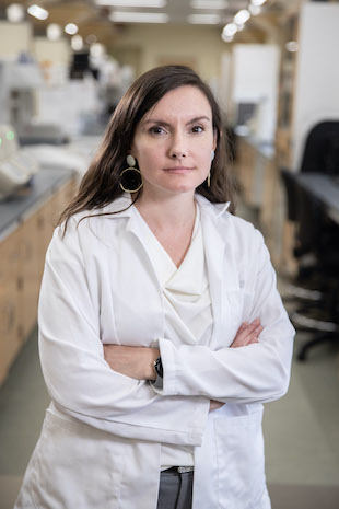 Fiona Hollis in a lab coat