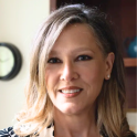 Dr. Kristen Harrison is smiling at the camera in her headshot