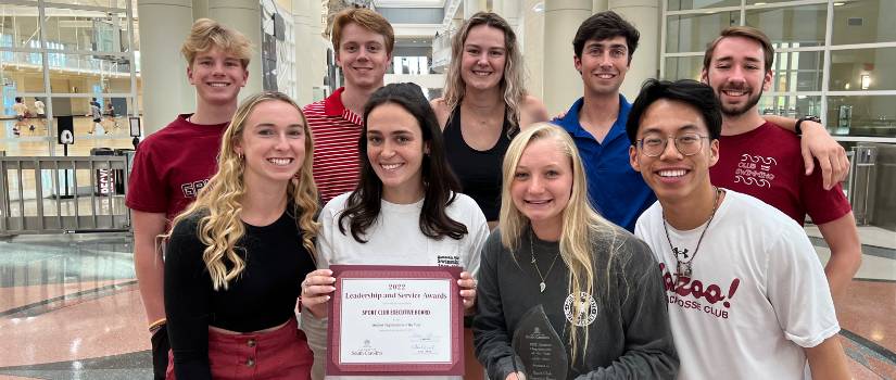 Sport Club Executive Board students holding the award for the 2022 Student Organization of the Year.