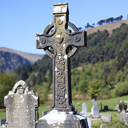 a worn, cross-shaped headstone