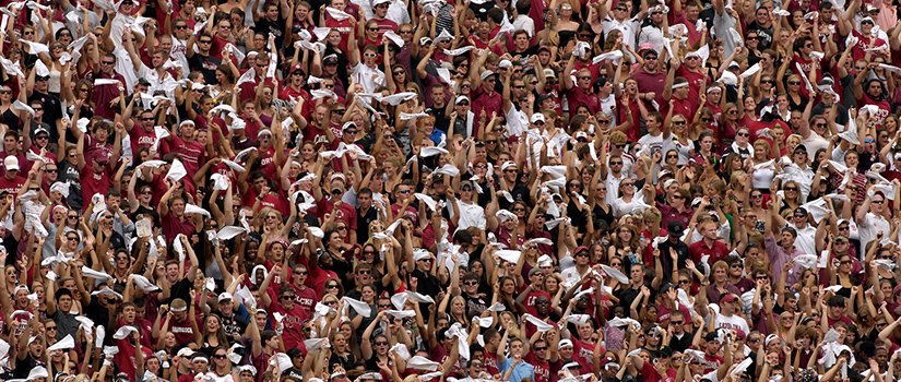 students cheering at a football game