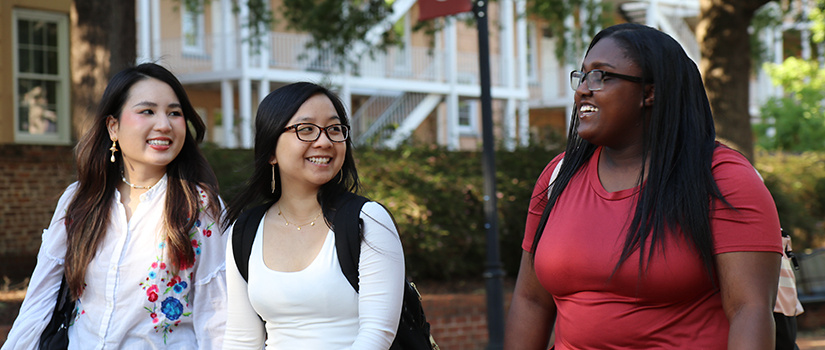 three students walking on the Horseshoe