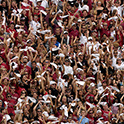 students cheering at a football game