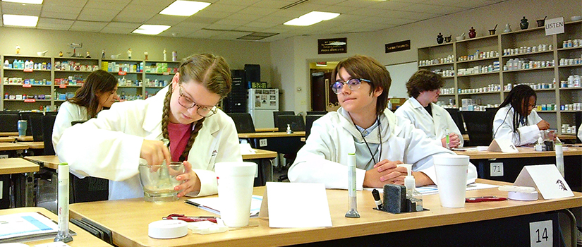 Two students working in a pharmacy lab
