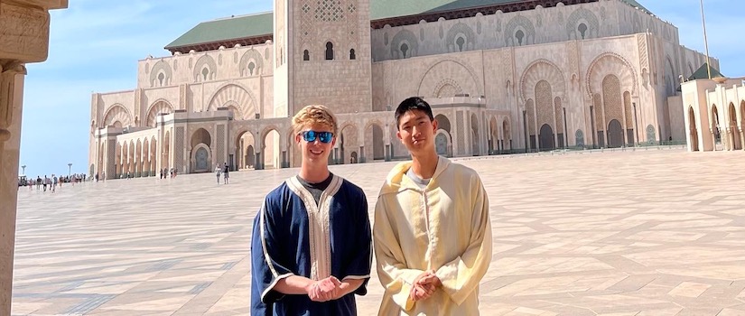 two students posing in front of a site in Morocco