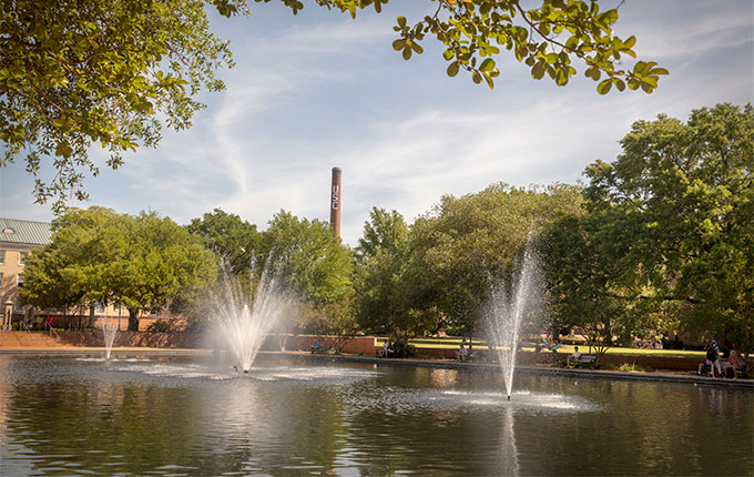 Looking at the smokestack from the reflecting pool in front of Thomas Cooper Library