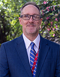 Professional headshot of Harlan Smith