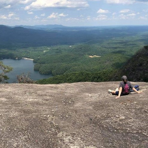 Student sitting on the overlook at Table Rock.