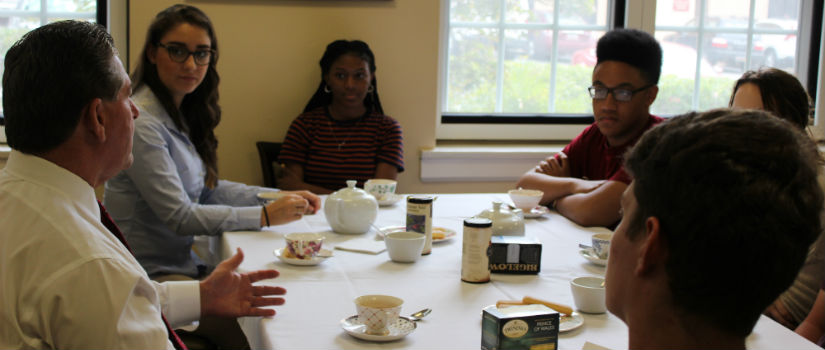 Student discussion over tea