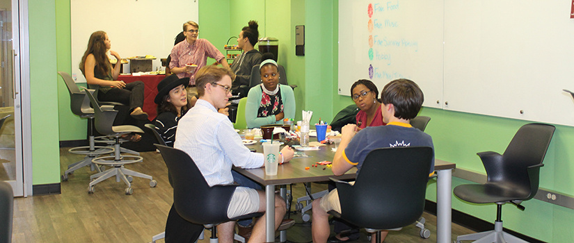 Students and staff meet in the intersection lounge. 