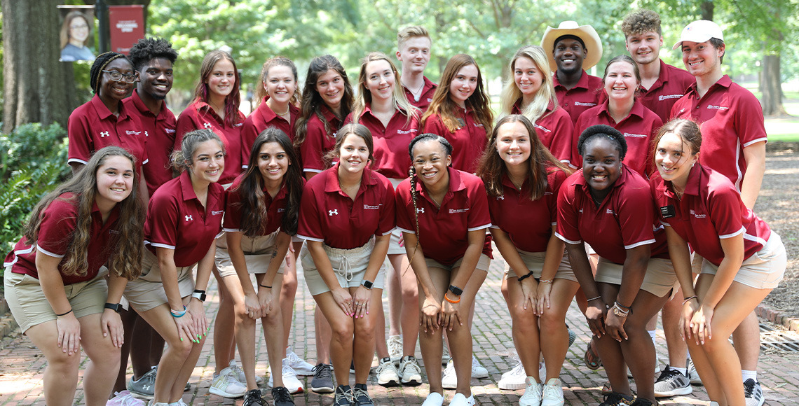 Orientation leaders posing for a photo outside on the Horseshoe
