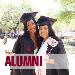 Image of two girl in graduation caps and gowns with a title that reads Alumni