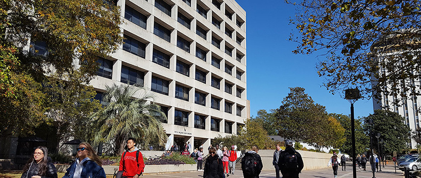 PIcture of the Close-Hipp building with students walking