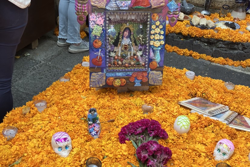 A Mexican ofrenda surrounded by marigolds