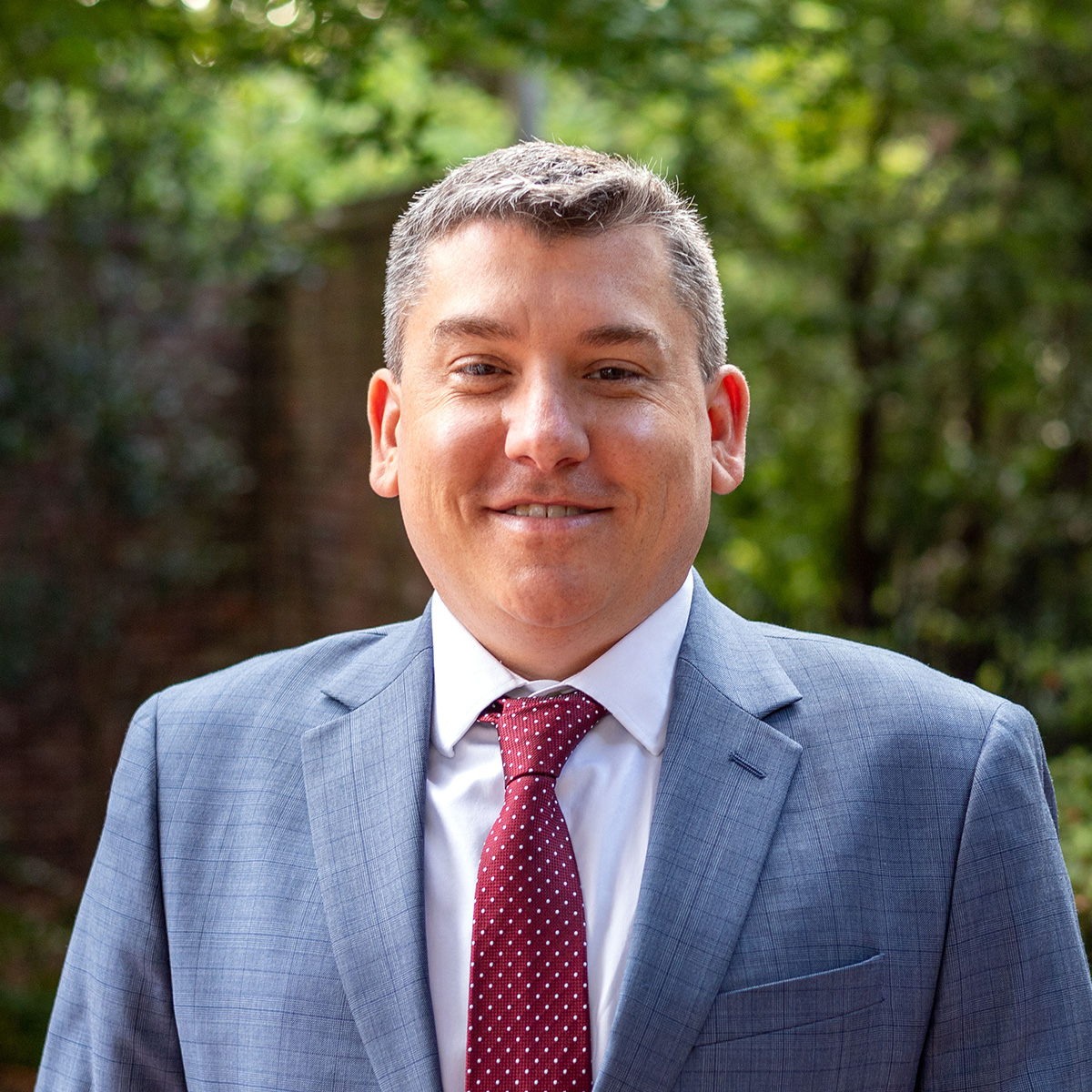 Professional headshot of Brad West