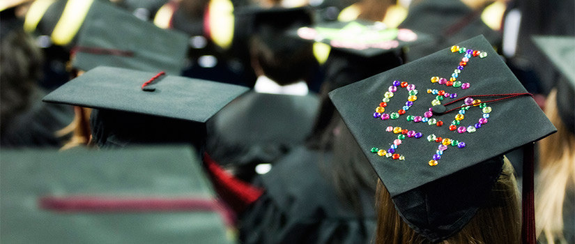 decorated mortar board at commencement ceremony