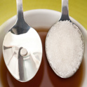 Sugar and sweetener in spoons