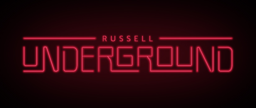A red neon sign reads "Russell Underground". 