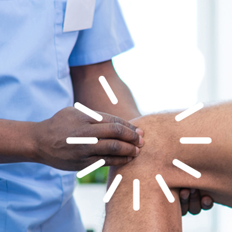 A medical professional examines a patient's knee