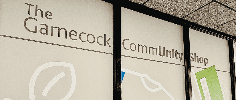 Graphics on windows of the Gamecock Community Shop entrance 