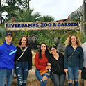 students posing infront of the riverbanks zoo sign