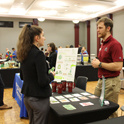A student talking to a potential employer at the annual Green Career Fair