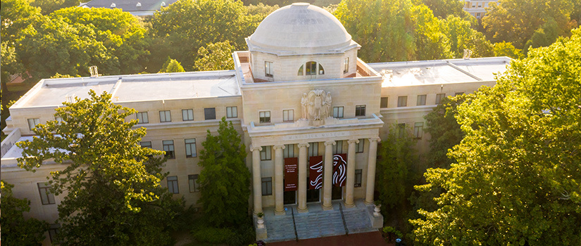 Drone shot of the UofSC Visitor Center on the Horseshoe as the sun is setting
