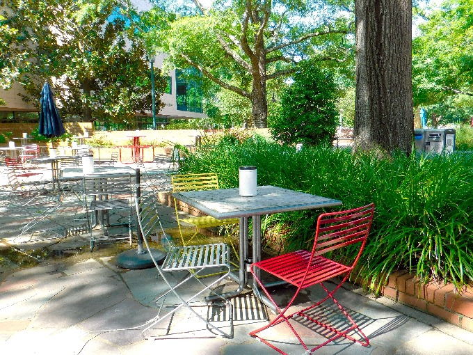 colorful table and chairs in the Russell House courtyard