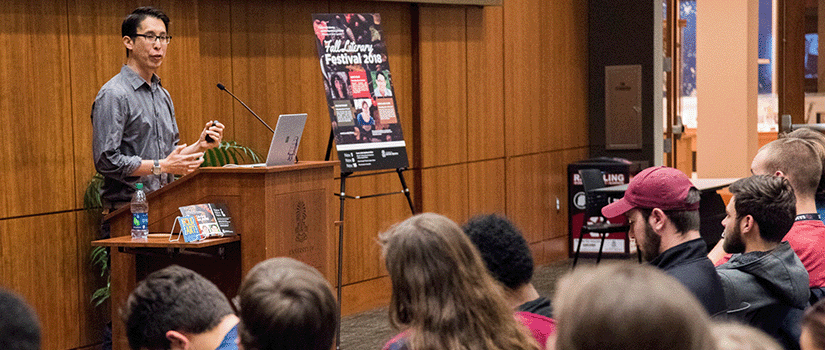 Cartoonist Gene Luen Yang speaking to students at the 2018 Fall Literary Festival