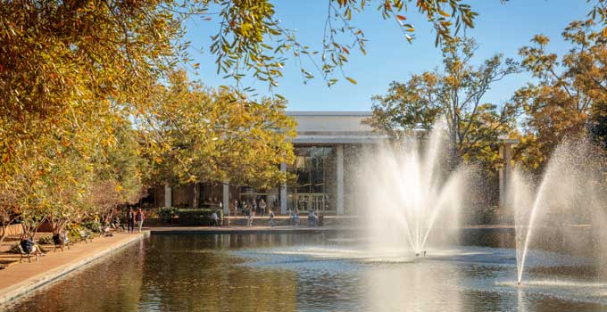 Fall photo of the library and reflecting pond