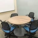 small round table and four blue chairs