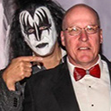 KISS collection donor with Gene Simmons pointing at his head