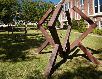 Outdoor sculpture garden featuring numerous studnet and alumni artwork.