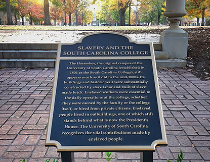 Plaque at the top of the horseshoe acknowledgin the contribution of enslaved people building the original University of South Carolina campus. 